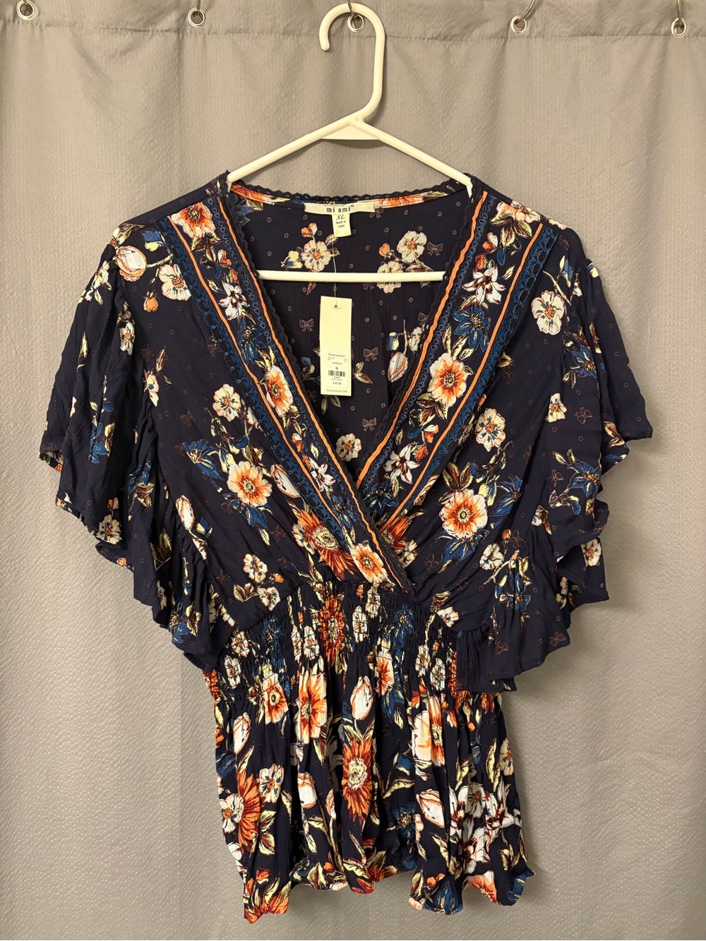 Women's Navy Floral Wrap-Style blouse from Francesca’s Boutique